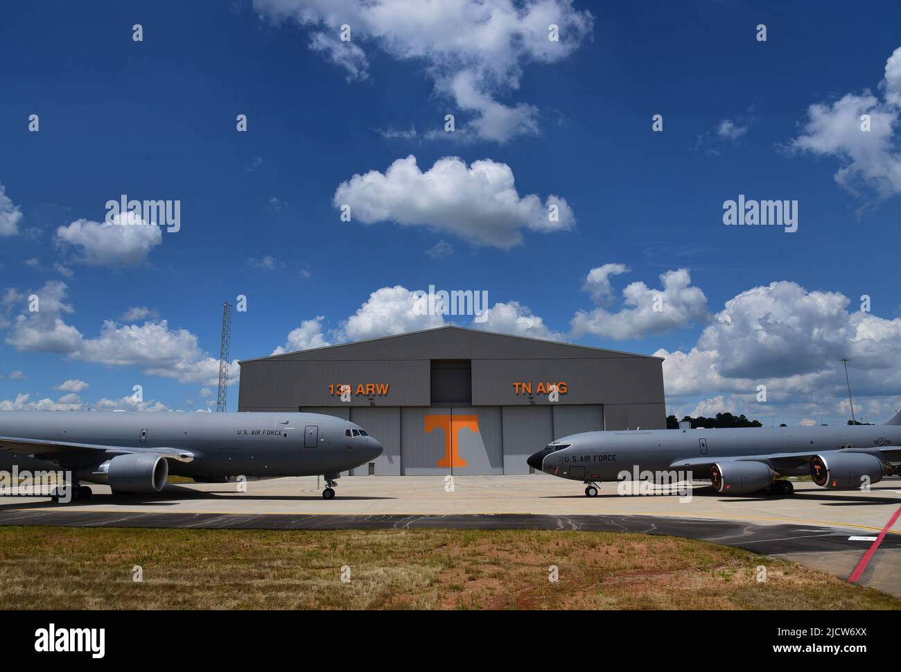 A KC-135R Stratotanker and a KC-46A Pregasus, both aerial refueling aircraft, sit in front of the new $31 million aircraft maintenance hangar at the 134th Air Refueling Wing, McGhee Tyson ANG Base, Tennessee.  The grand opening of the new hangar was held on Jun. 3, with Airmen and community members present for the event. Stock Photo