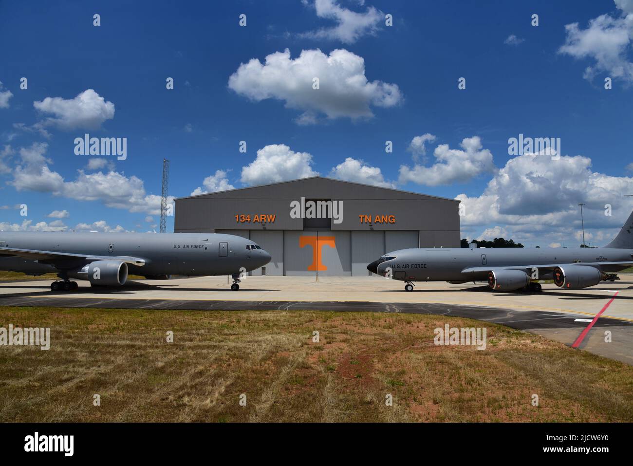 A KC-135R Stratotanker and a KC-46A Pegasus, both aerial refueling aircraft, sit in front of the new $31 million aircraft maintenance hangar at the 134th Air Refueling Wing, McGhee Tyson ANG Base, Tennessee.  The grand opening of the new hangar was held on Jun. 3, with Airmen and community members present for the event. Stock Photo