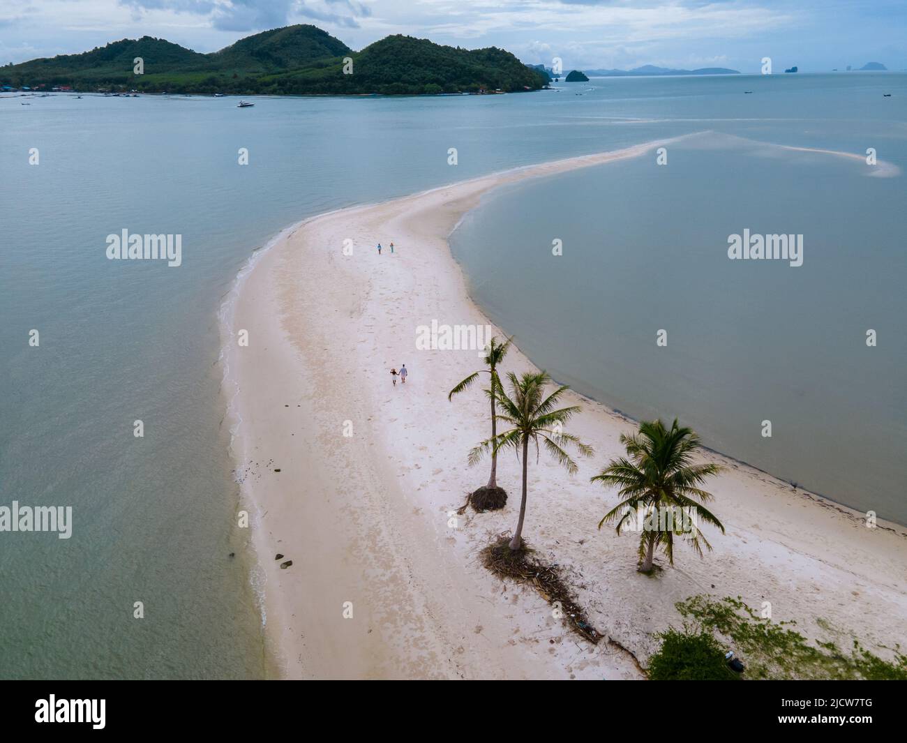 couple of men and women walking on the beach at the Island Koh Yao Yai ...