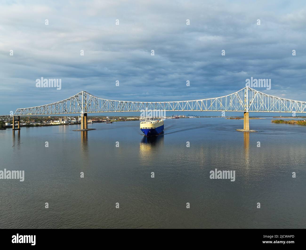 A Vehicle Carrier Ship Passing under the Commodore Barry Bridge Stock Photo