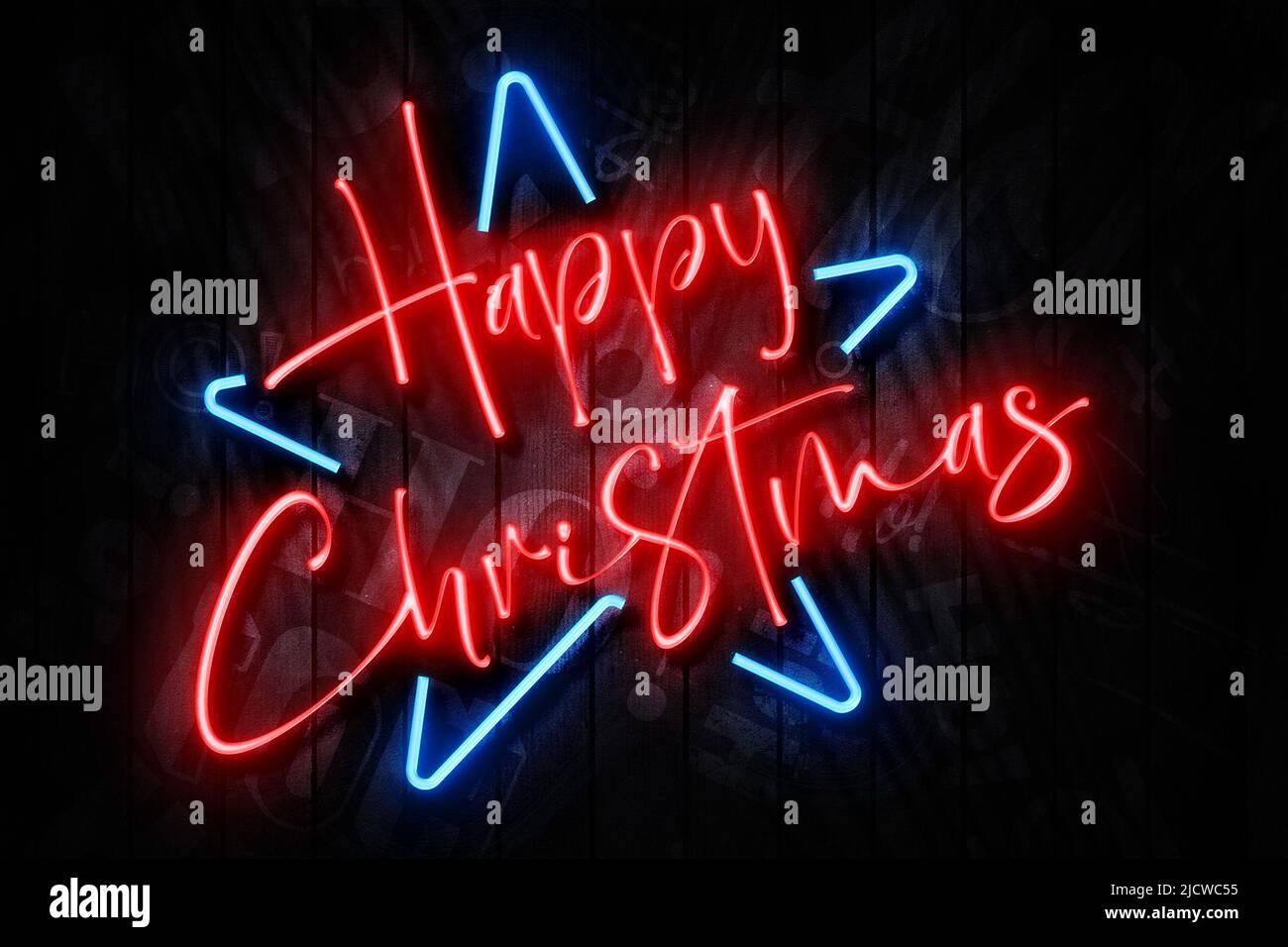 Happy Christmas Neon Sign on a Dark Wooden Wall with neon star and Ho Ho Ho text background Stock Photo