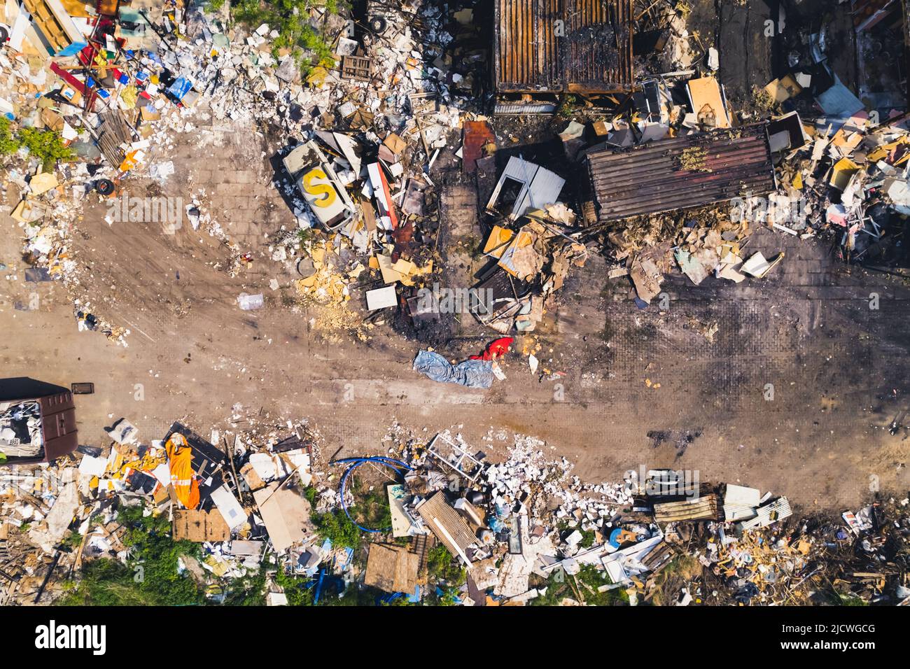 Horizontal aerial shot of a garbage dump with stacks and piles of rubbish. . High quality photo Stock Photo