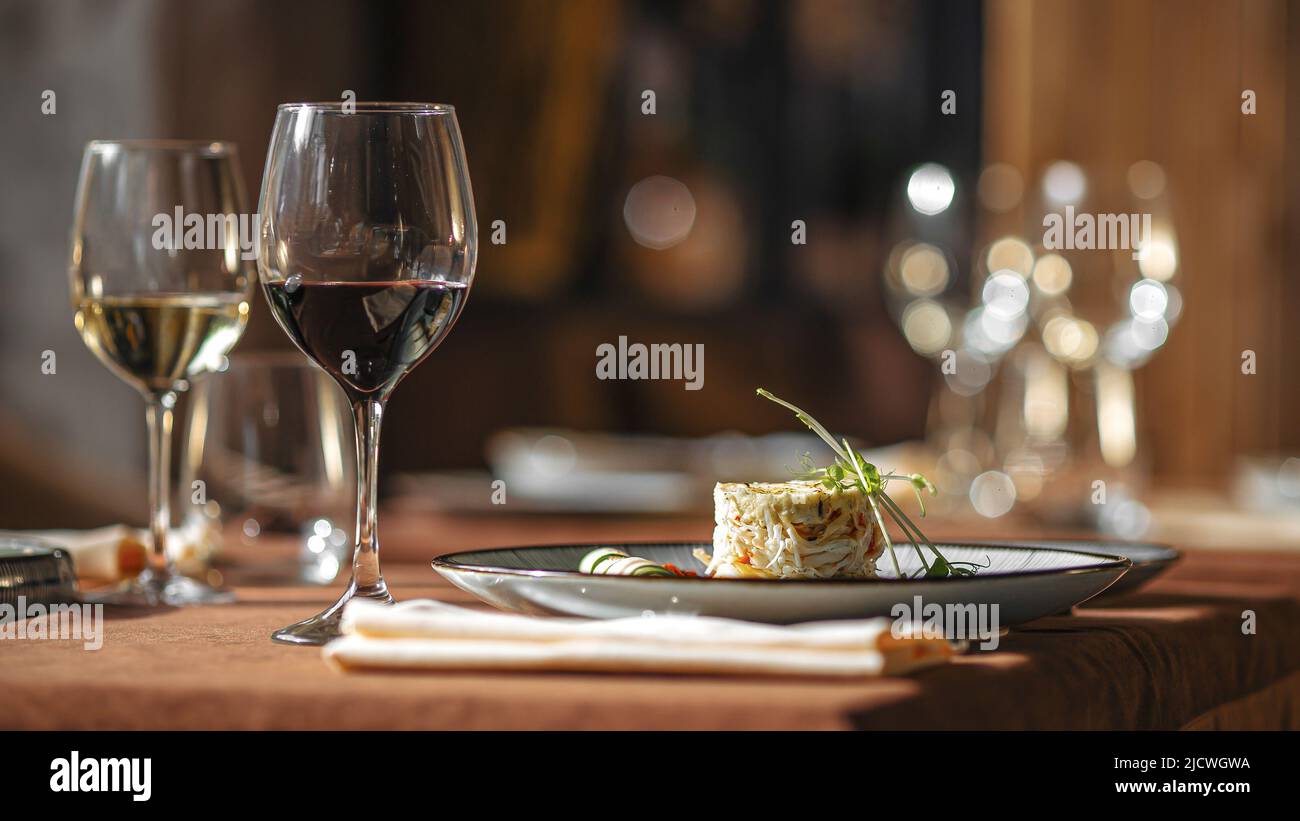 Served restaurant table with drinks and food Stock Photo