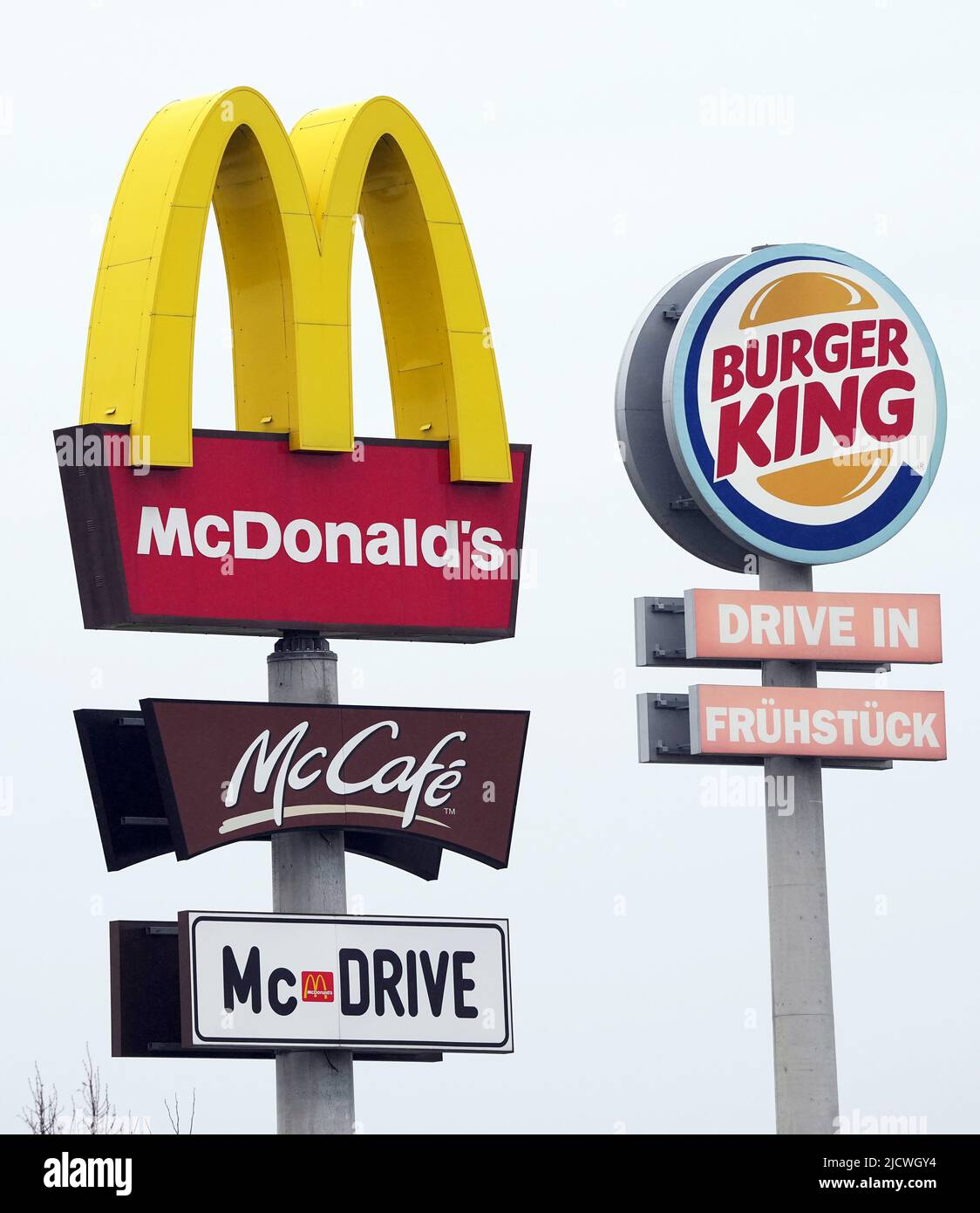 Germany. 30th Apr, 2022. The logos of Mcdonald's and McCafe as well as Burger King stand next to the respective fast food restaurants at a highway rest stop. Credit: Soeren Stache/dpa/Alamy Live News Stock Photo