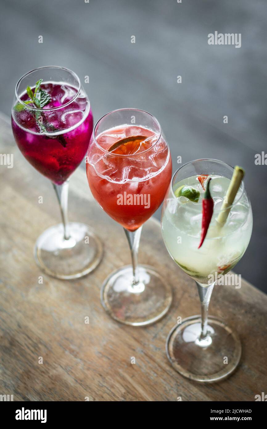 mixed spritzer wine cocktails selection with fruit in outdoor bar table Stock Photo