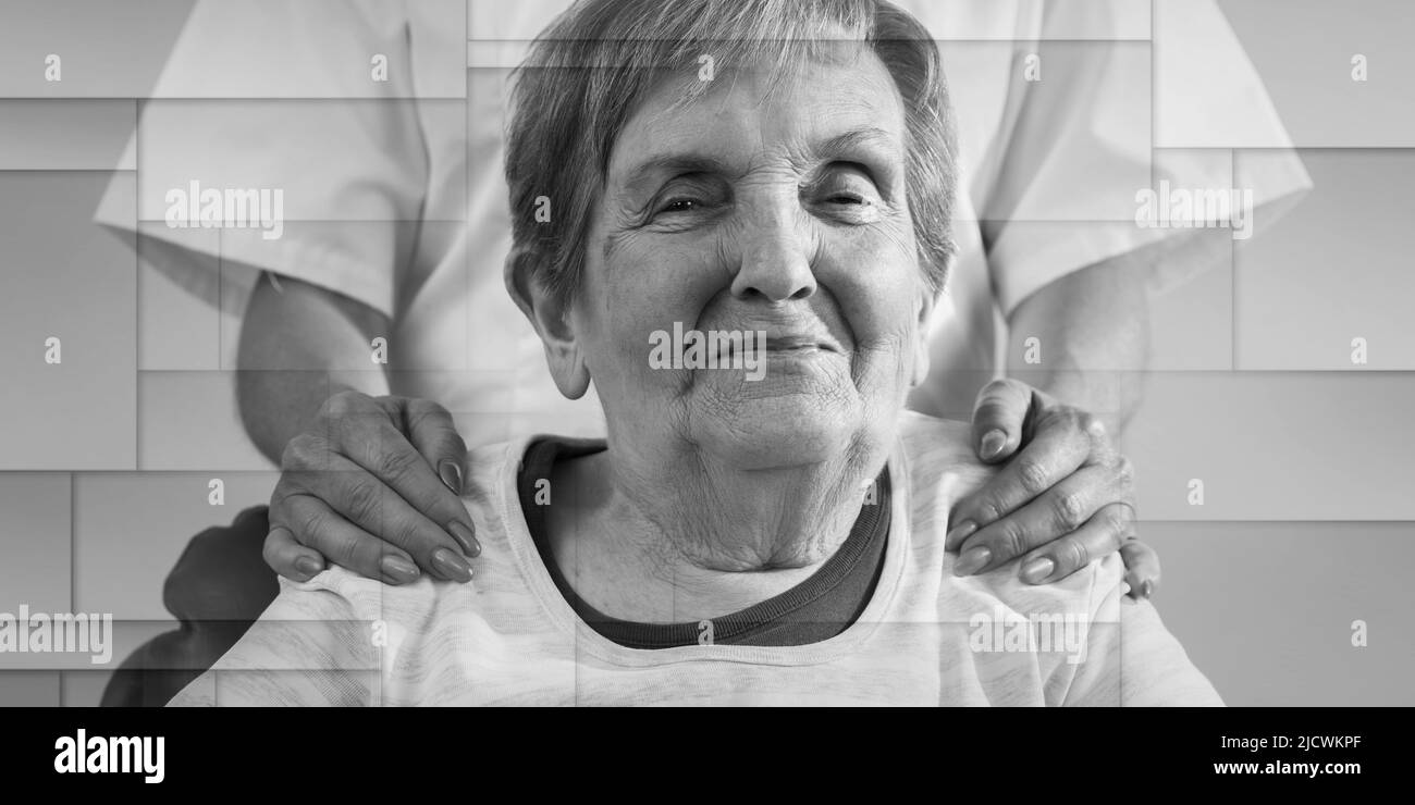 Nurse with her hands on the shoulder of a senior woman, geometric pattern Stock Photo