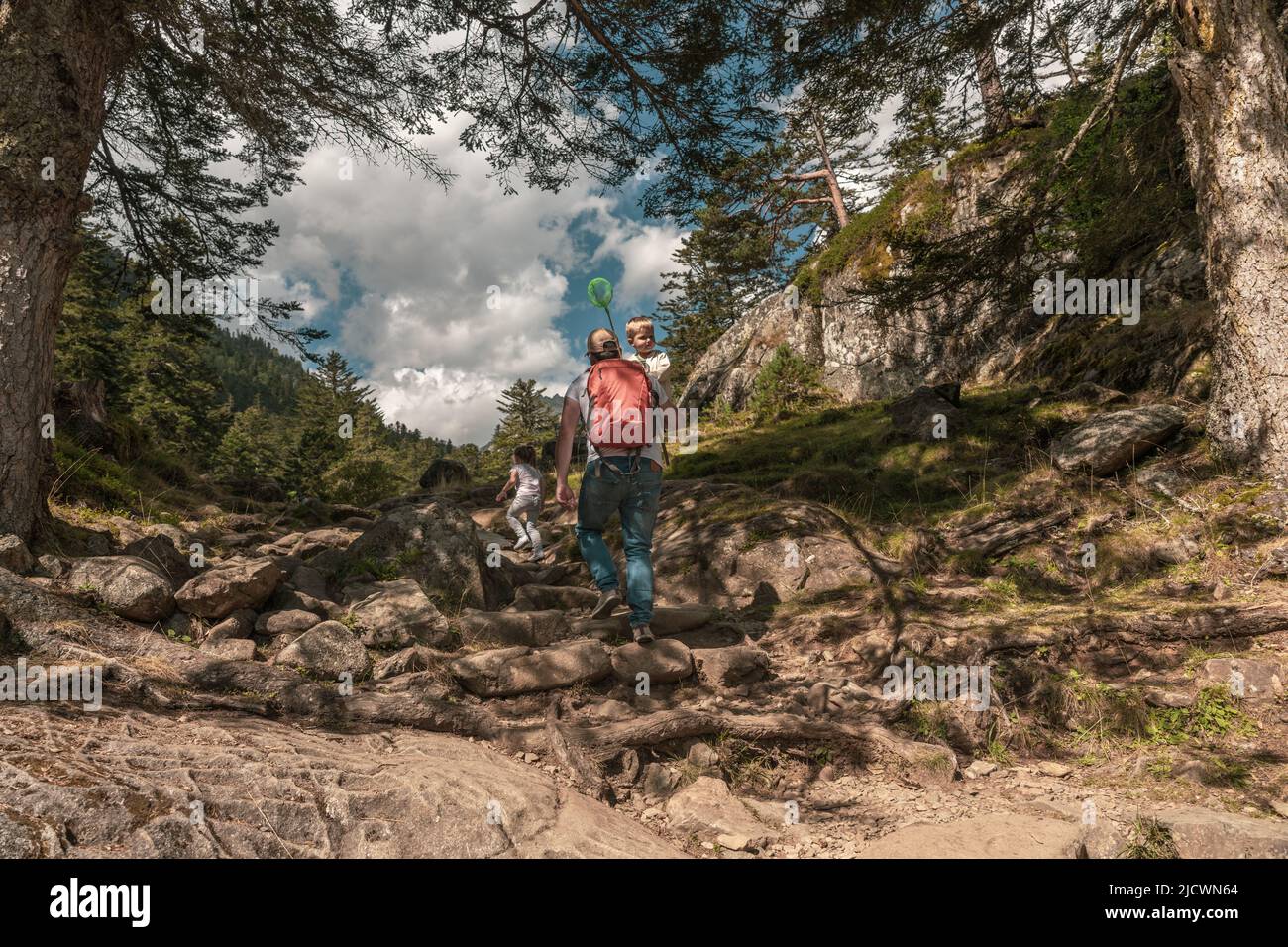 Family hiking in the mountain Stock Photo - Alamy