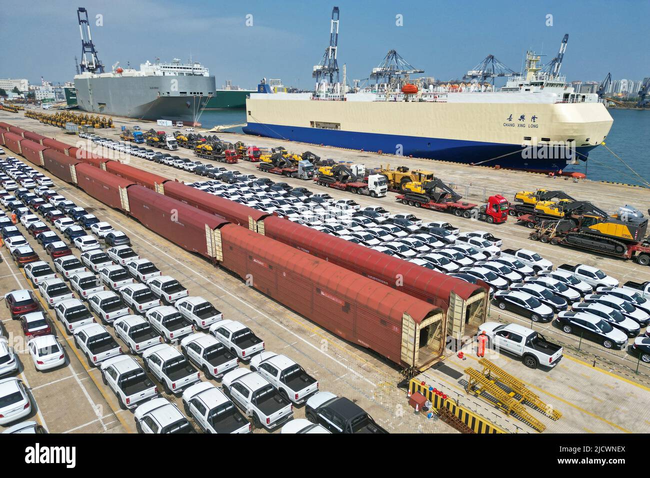 YANTAI, CHINA - JUNE 16, 2022 - A staff member drives an export truck from a freight train in Yantai port, East China's Shandong Province, June 16, 20 Stock Photo