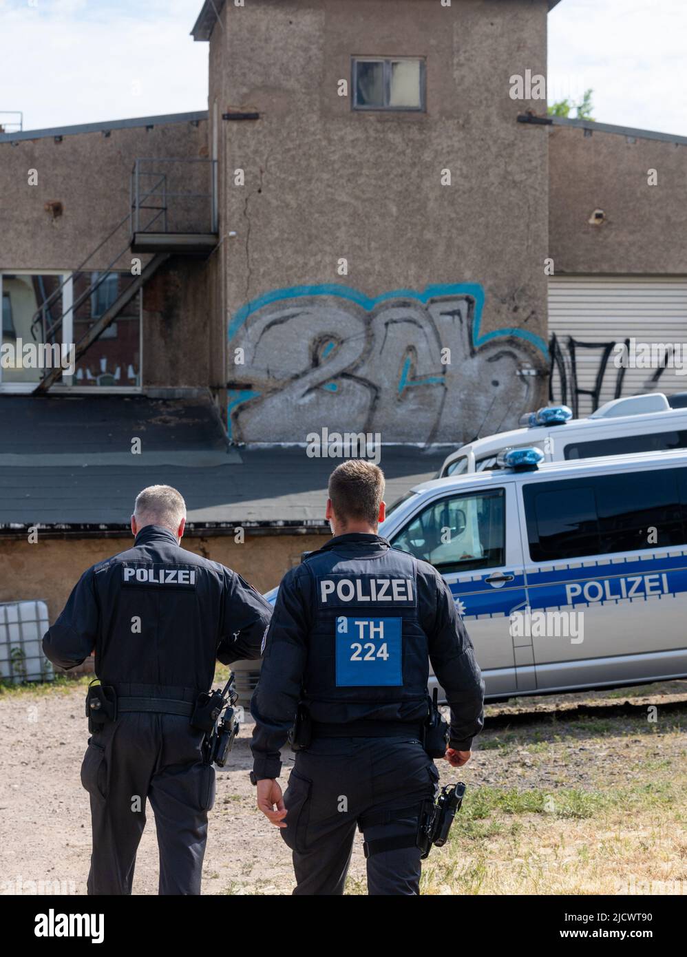 Gotha, Germany. 16th June, 2022. Police officers search a factory building during a raid. With a large contingent, police searched a total of 26 residential and business premises in Thuringia, Schleswig-Holstein and Berlin on Thursday. According to the Thuringian State Criminal Police Office (TLKA), more than 500 officers from Thuringia and special forces from other federal states were deployed. Suspicion exists because of the trade with narcotics in connection with money laundering as well as offence against the weapon law. Credit: Michael Reichel/dpa-Zentralbild/dpa/Alamy Live News Stock Photo