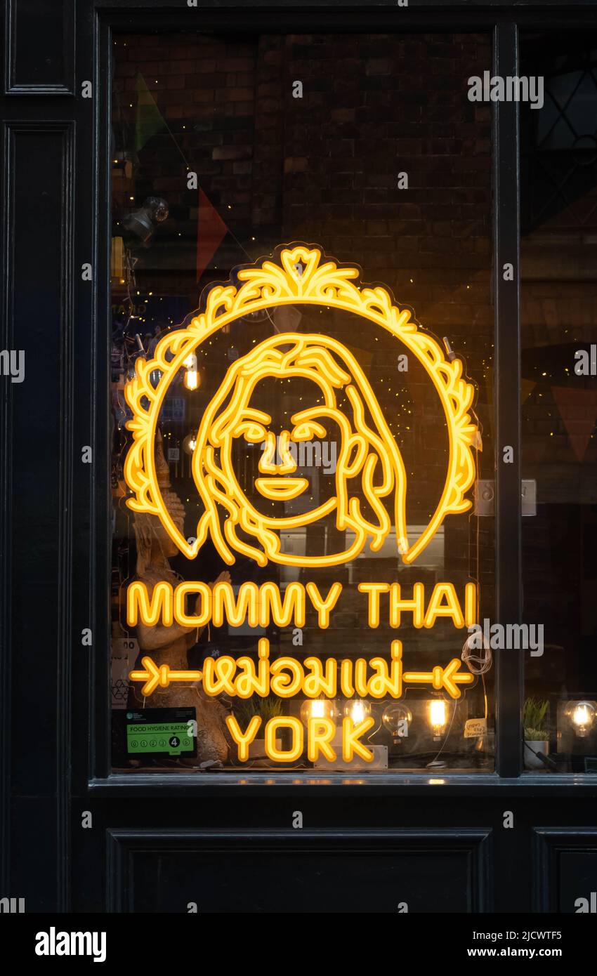 Mommy Thai sign in window of an Asian restaurant in the City of York, UK Stock Photo