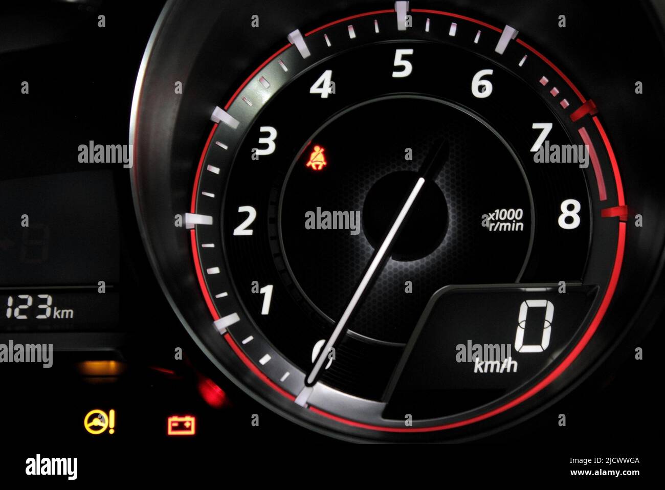 Close up glowing tachometer needle on zero engine speed on the car dashboard Stock Photo Alamy