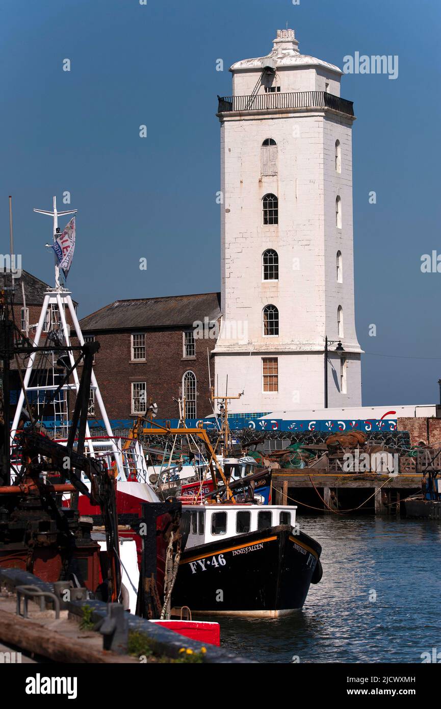 Fishing boats and Low Lights lighthouse at North Shields Fish Quay
