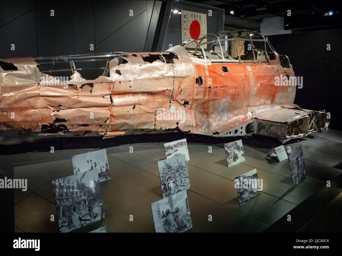 The wreckage of a WW2 Mitsubishi Zero A6M war plane on display at the Imperial War Museum (IWM) in London. The wreckage was found in the Marshall Isla Stock Photo