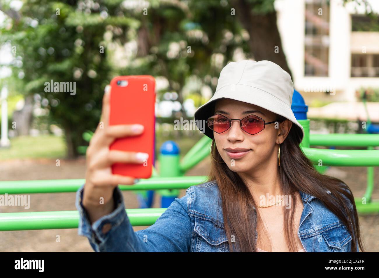 Cool Young Woman Taking Selfie Stock Photo - Alamy