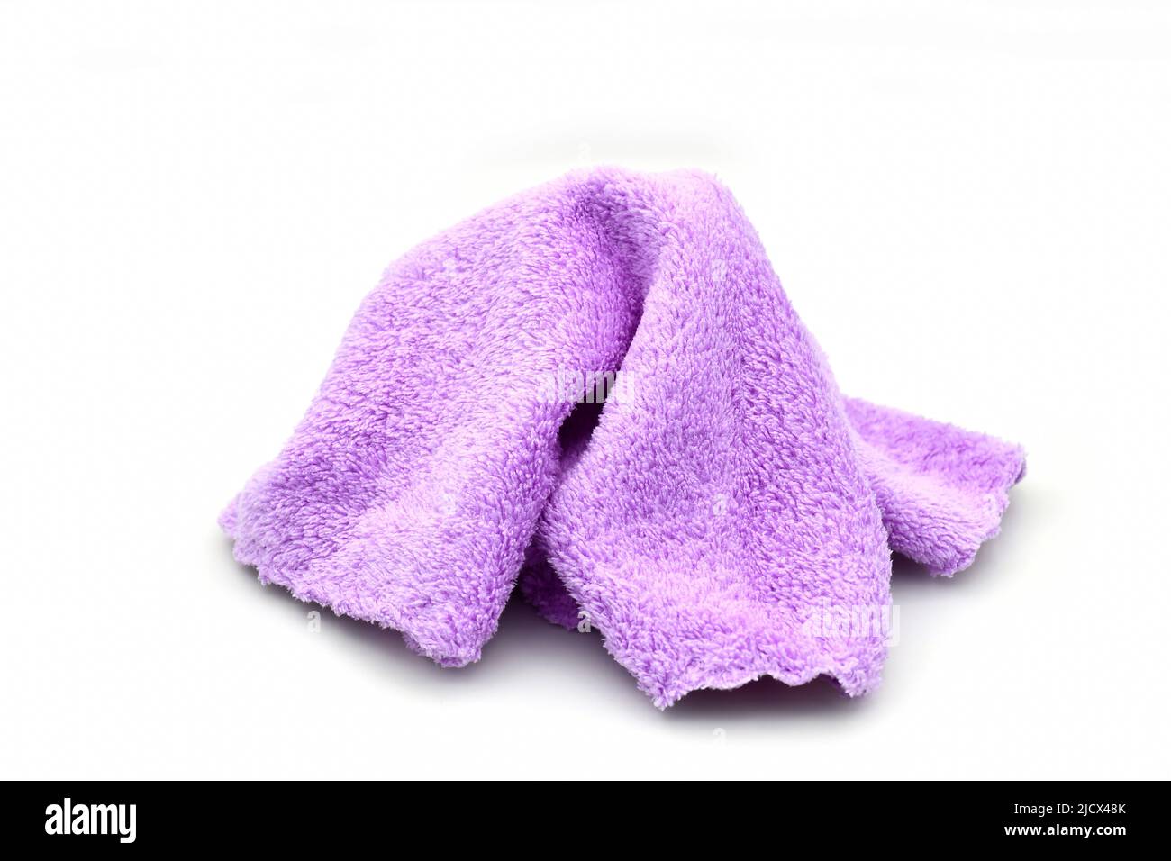 Tiny soft cleaning cloth on white background. Stock Photo