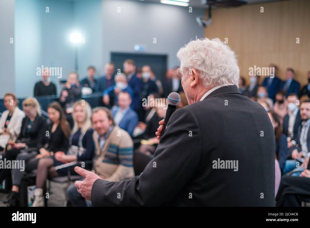 Elderly speaker talking to audience Stock Photo Alamy