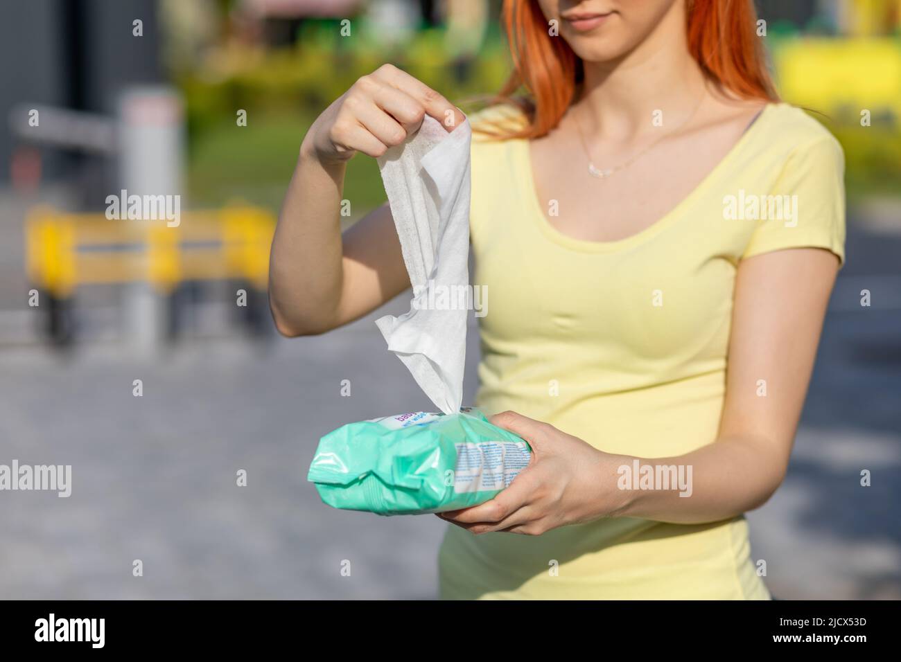 Taking one wet wipes from the packaging hygiene procedure and