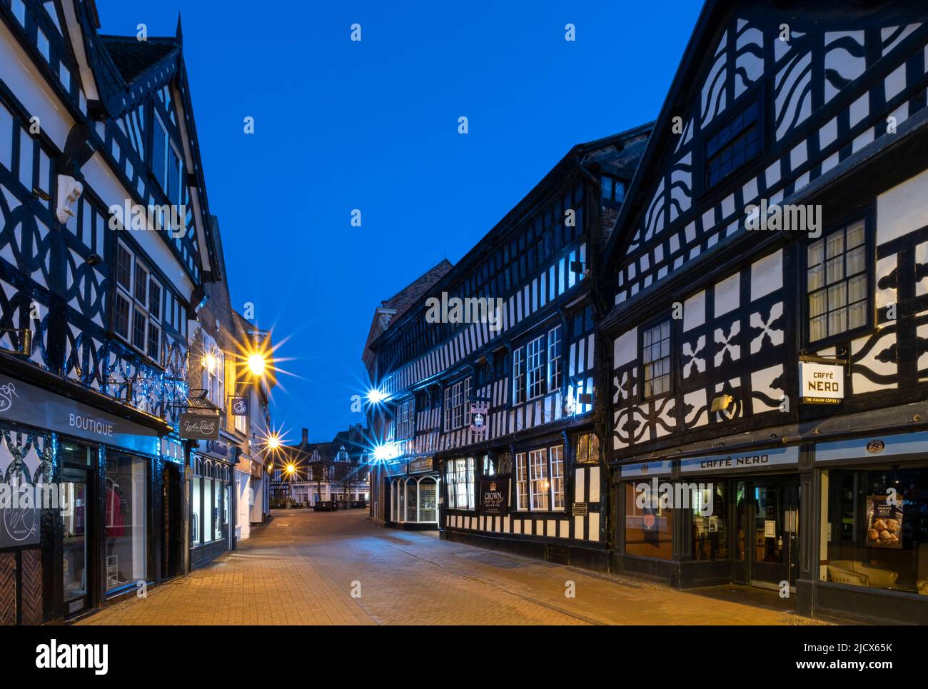 The 16th century Crown Inn and Medieval buildings at night, High Street, Nantwich, Cheshire, England, United Kingdom, Europe Stock Photo