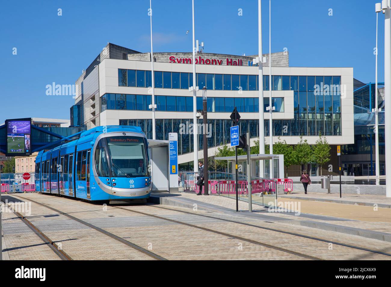 View of tram in front of Repertory Theatre, Centenary Square, Birmingham, West Midlands, England, United Kingdom, Europe Stock Photo