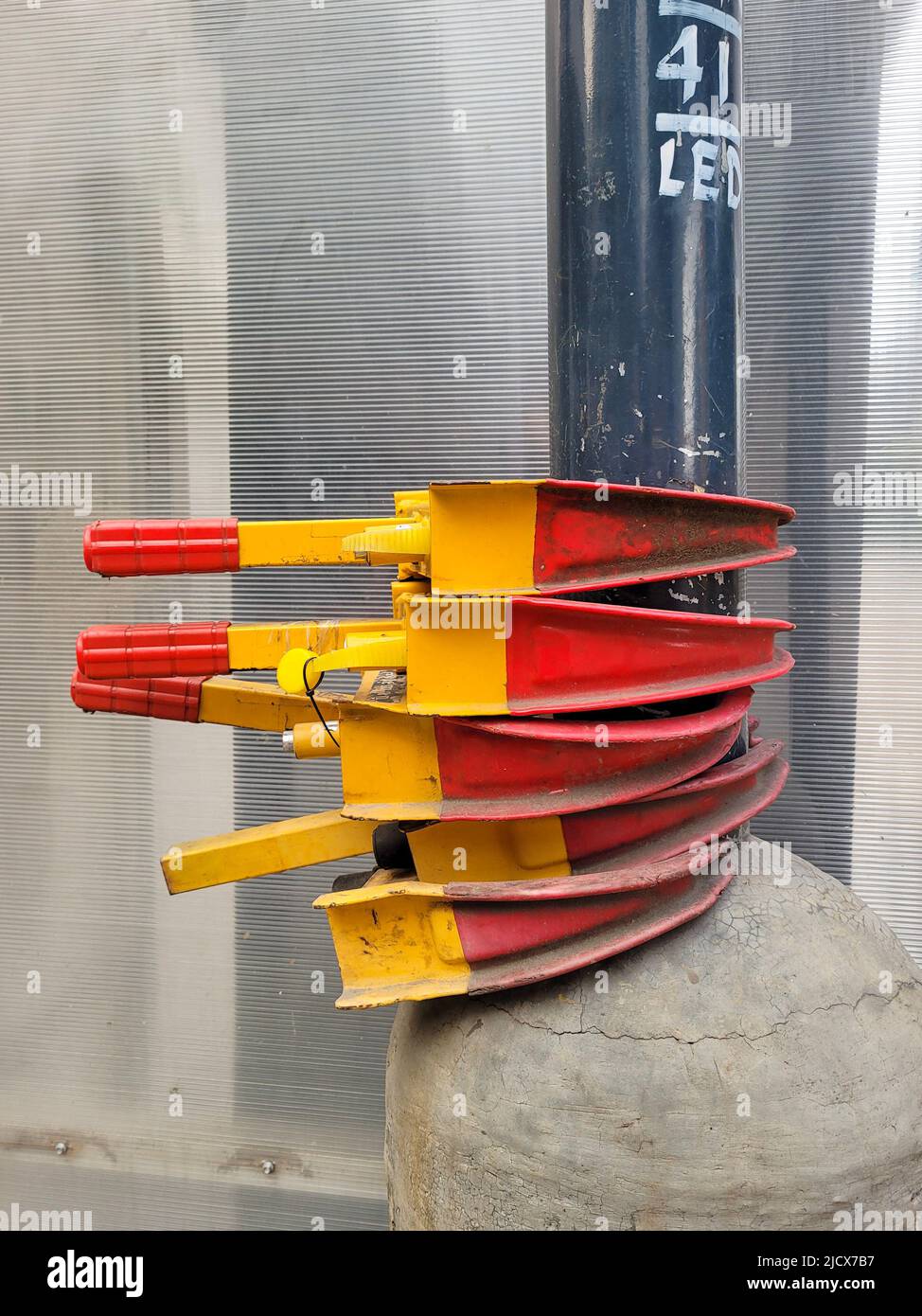 Four parking clamps stored by the traffic police waiting to be used for illegally parked vehicles Stock Photo