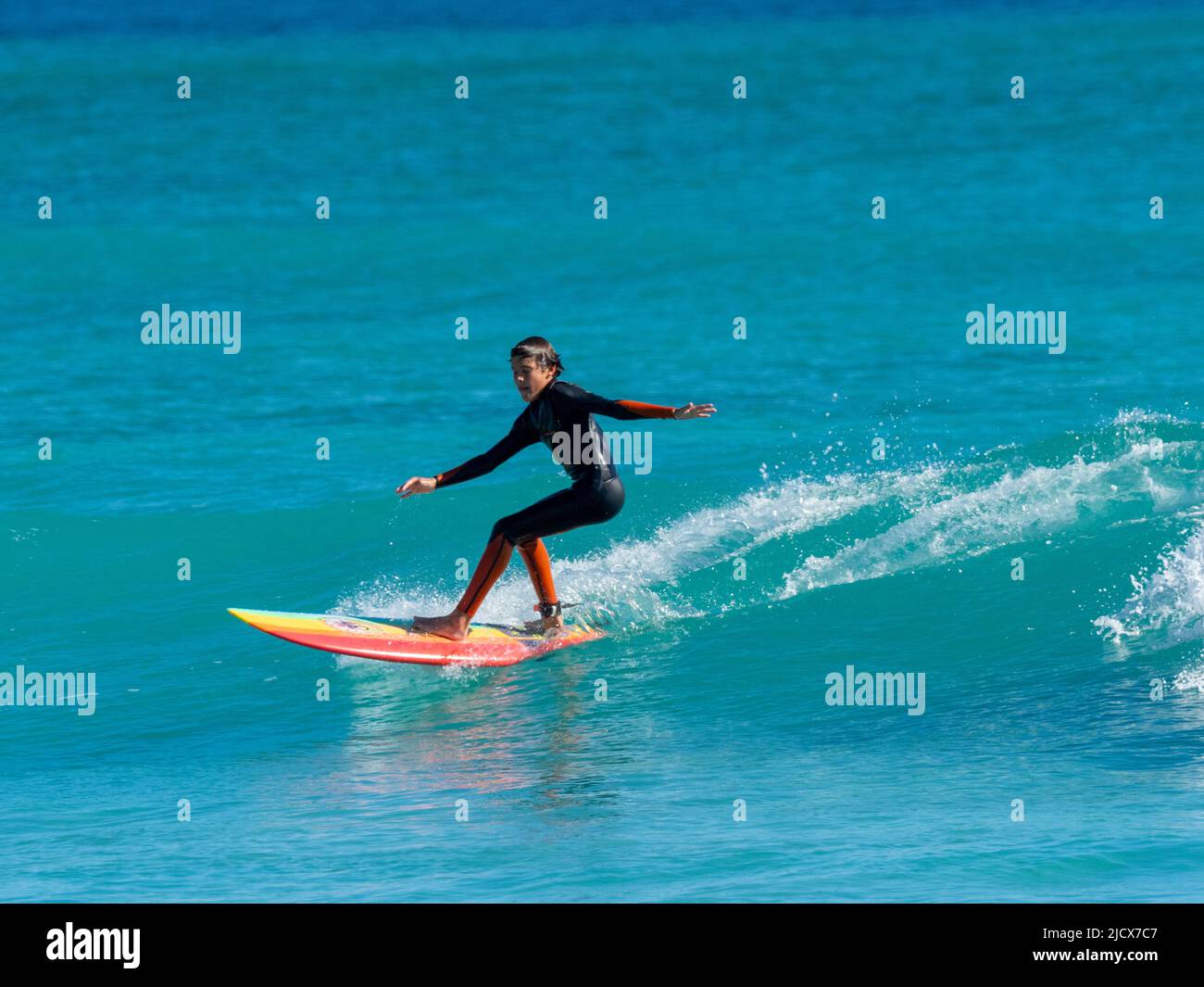Surfer riding a wave at Ningaloo Reef, Western Australia, Australia, Pacific Stock Photo