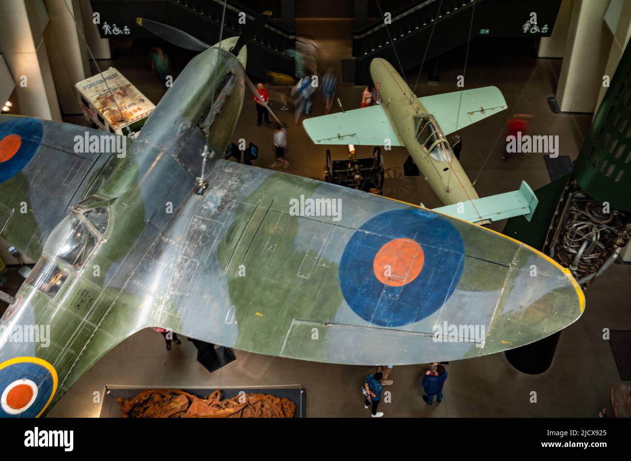 A Spitfire is displayed above a Japanese Yokosuka kamikaze jet plane at the Imperial War Museum (IWM) in London. Stock Photo