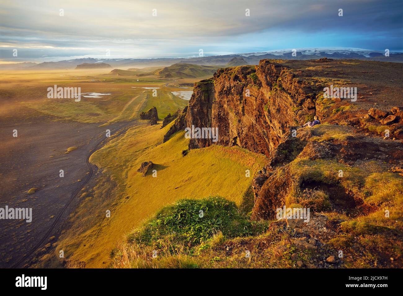 Cliff and mountain view from Dyrholaey Island, just before sunset, near Vik, south coast of Iceland, Polar Regions Stock Photo