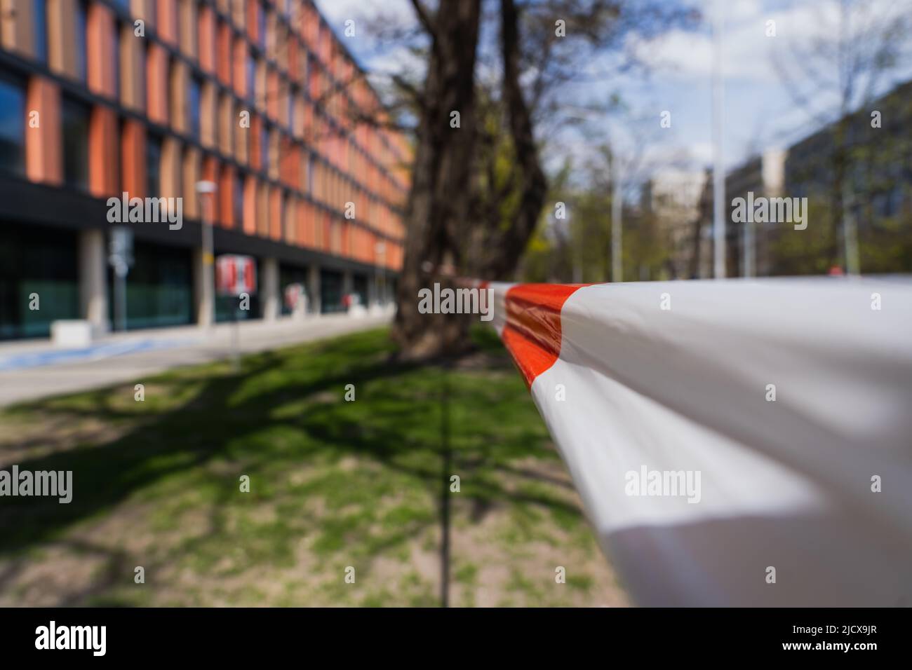 barrier tape on blurred urban street in Wroclaw Stock Photo Alamy