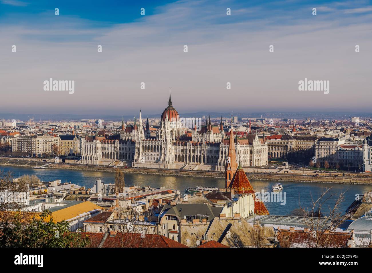 Panoramic day view of neo-Gothic style Orszaghaz Parliament complex landmark on the bank of River Danube, UNESCO World Heritage Site, Budapest Stock Photo
