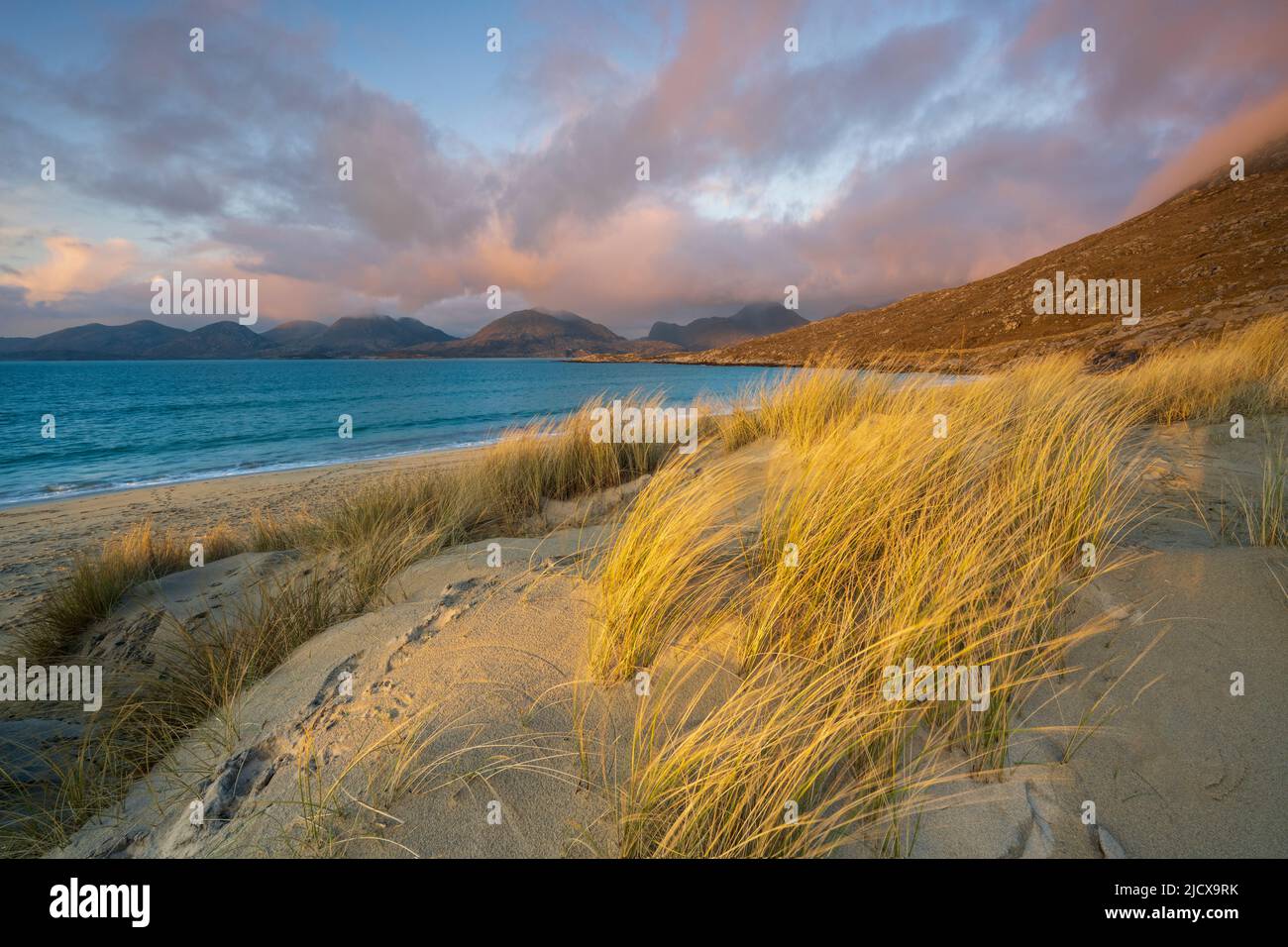 Marram grass and sand dunes on Luskentyre Beach, looking towards North Harris Forest Hills, South Harris, Outer Hebrides, Scotland, United Kingdom Stock Photo