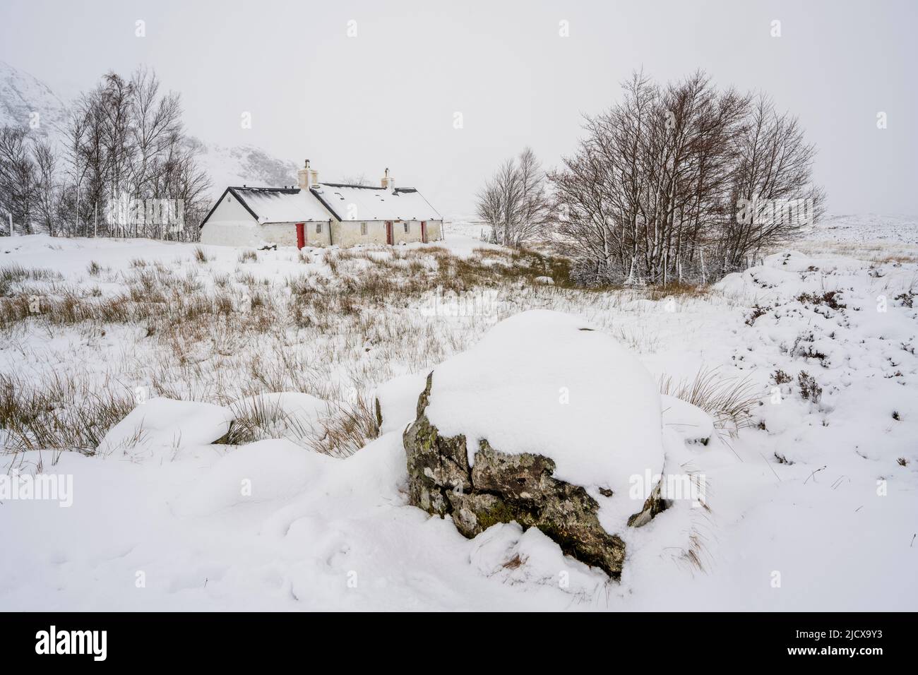 Black Rock Cottages in snow, Rannoch Moor, Glencoe, Highland region, Scotland, United Kingdom, Europe Stock Photo