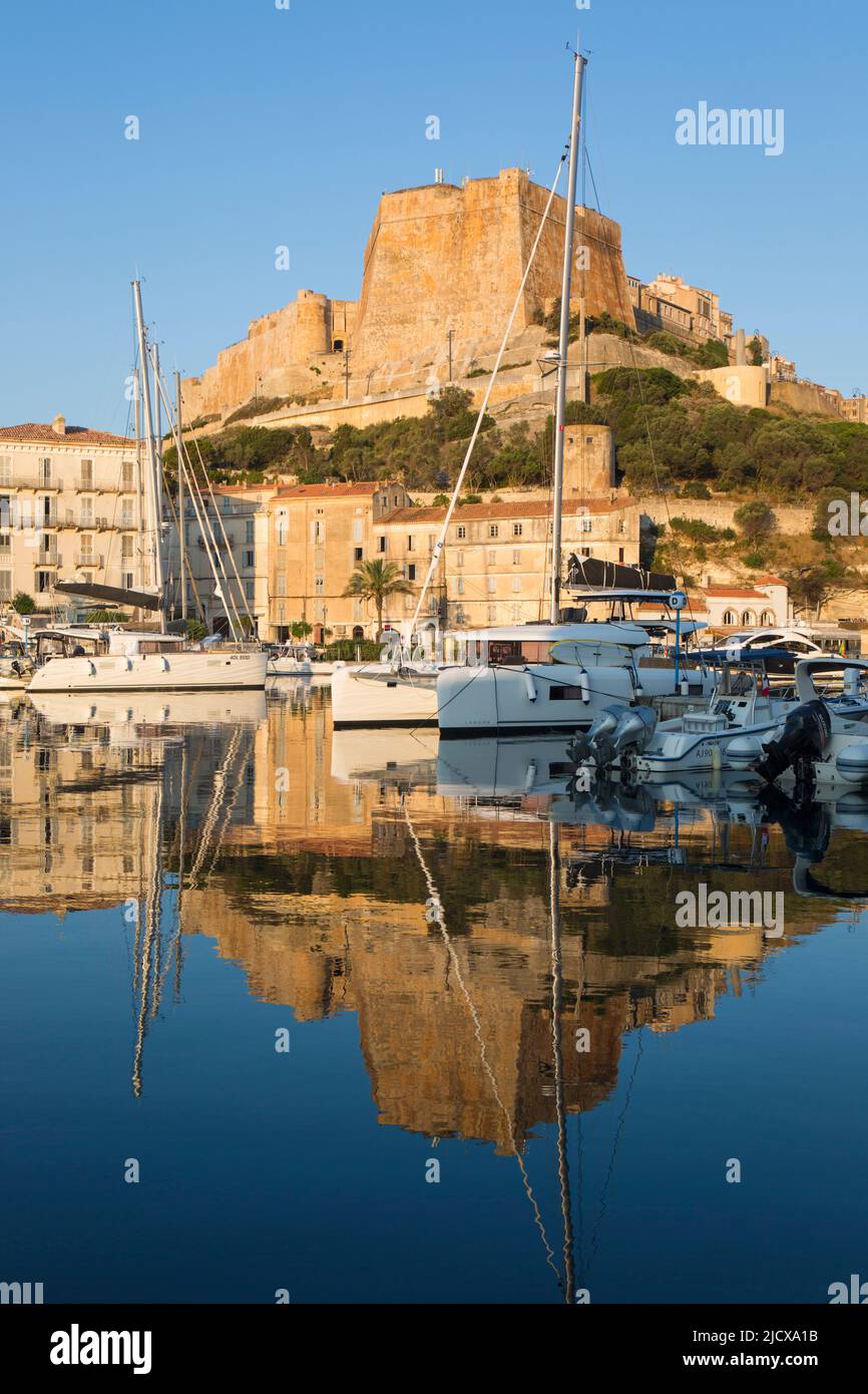 View across harbour to the citadel, sunrise, the Bastion de l'Etendard prominent, Bonifacio, Corse-du-Sud, Corsica, France, Mediterranean, Europe Stock Photo