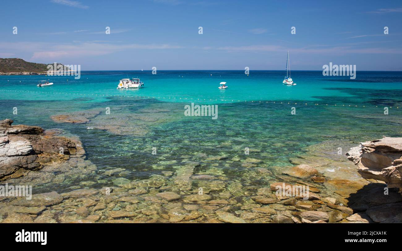 View across clear turquoise water from rocky coastline near the Plage du Loto, St-Florent, Haute-Corse, Corsica, France, Mediterranean, Europe Stock Photo