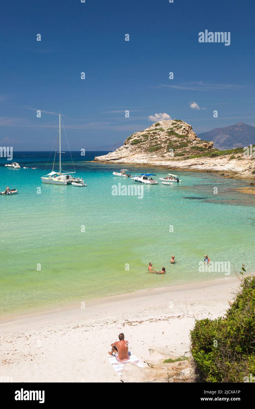 Tourists relaxing in shallow turquoise water off the Plage du Petit Loto, St-Florent, Haute-Corse, Corsica, France, Mediterranean, Europe Stock Photo