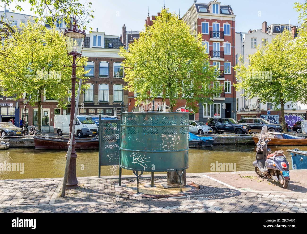 Traditional canal side public street urinal in Central Amsterdam, North Holland, The Netherlands, Europe Stock Photo