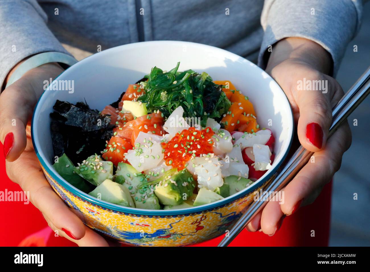 Asian cuisine, fish poke bowl with seaweed, avocado, cucumber, radish, sesame seeds, Haute-Savoie, France, Europe Stock Photo