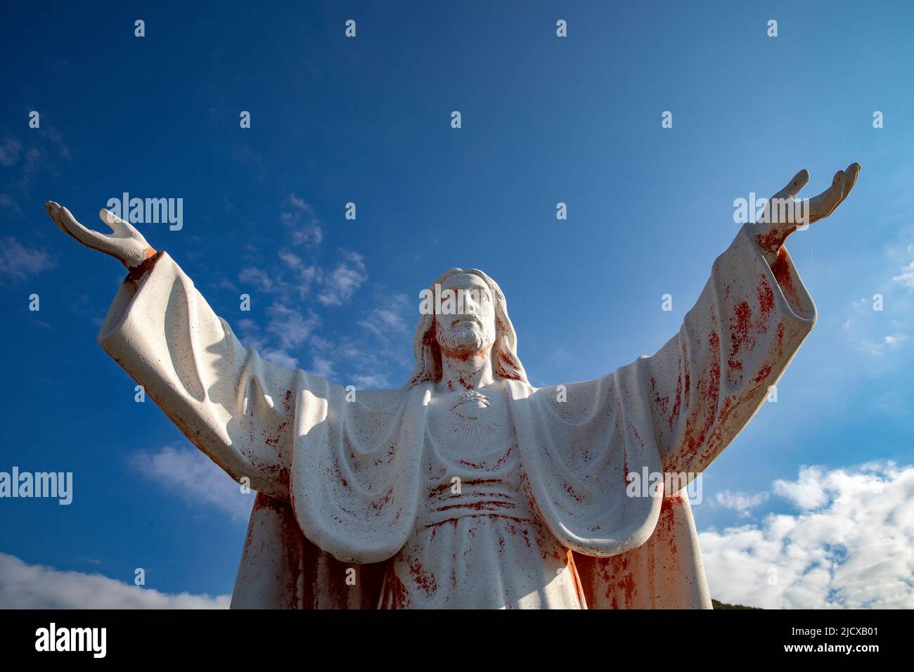 Statue of Jesus Christ with open arms in Delaj, Montenegro, Europe Stock Photo