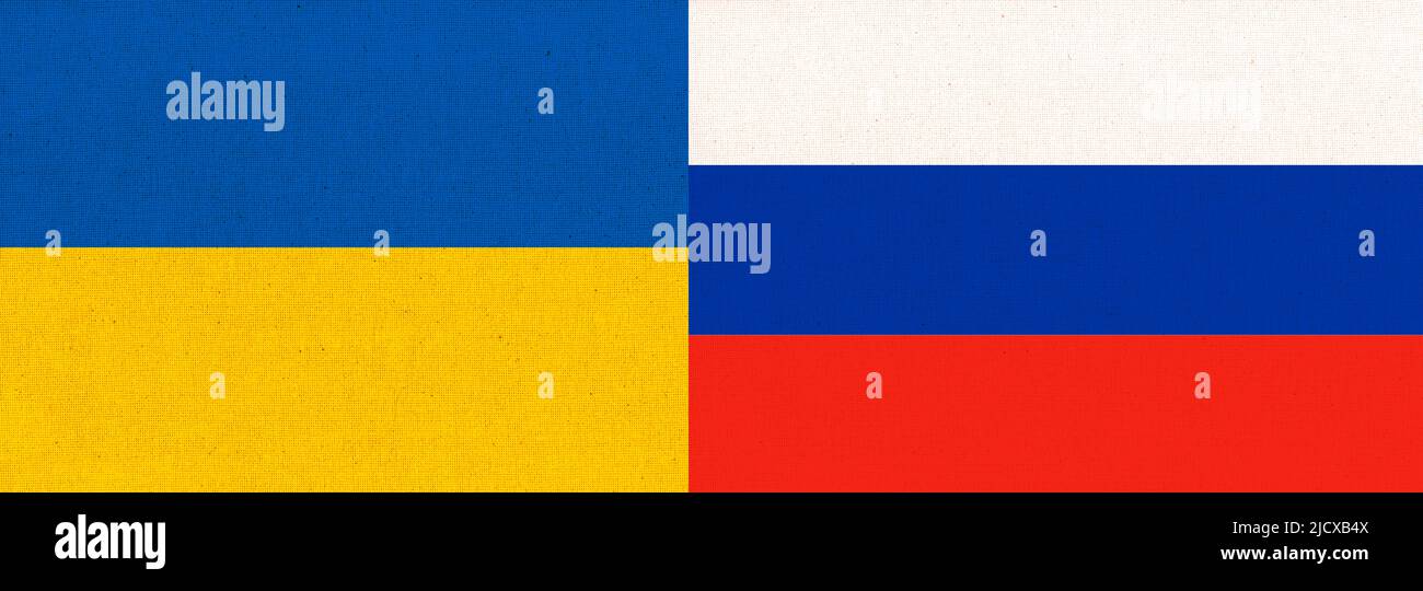 Relations between Ukraine and russia. Flag of the two countries. Ukraine and Russia two folded flags. Flag of Ukraine and Russia. Ukrainian and Russia Stock Photo