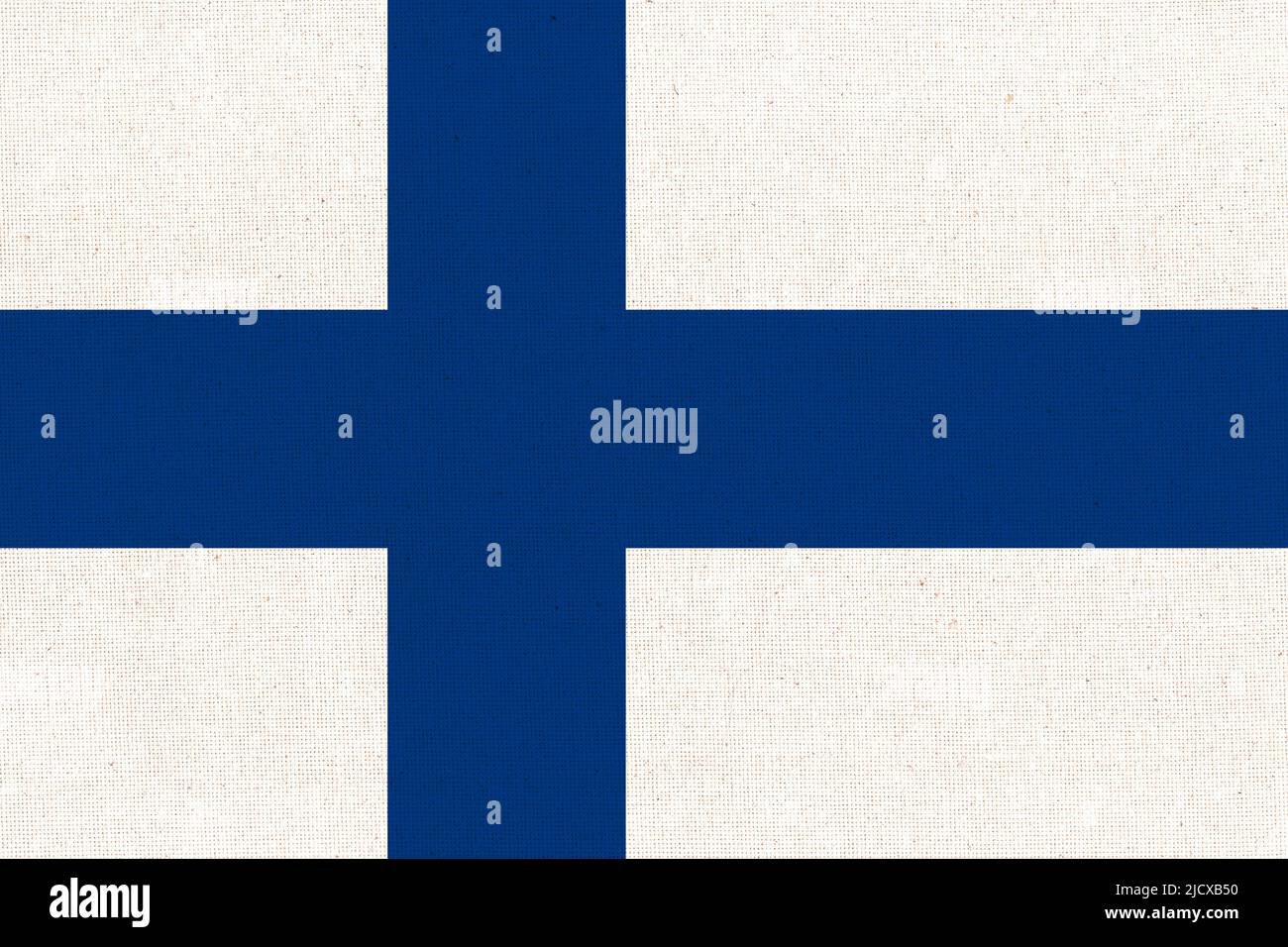 Flag of Finland. Finnish flag on fabric surface. Fabric texture. National symbol of Finland on patterned background. Scandinavian country Stock Photo