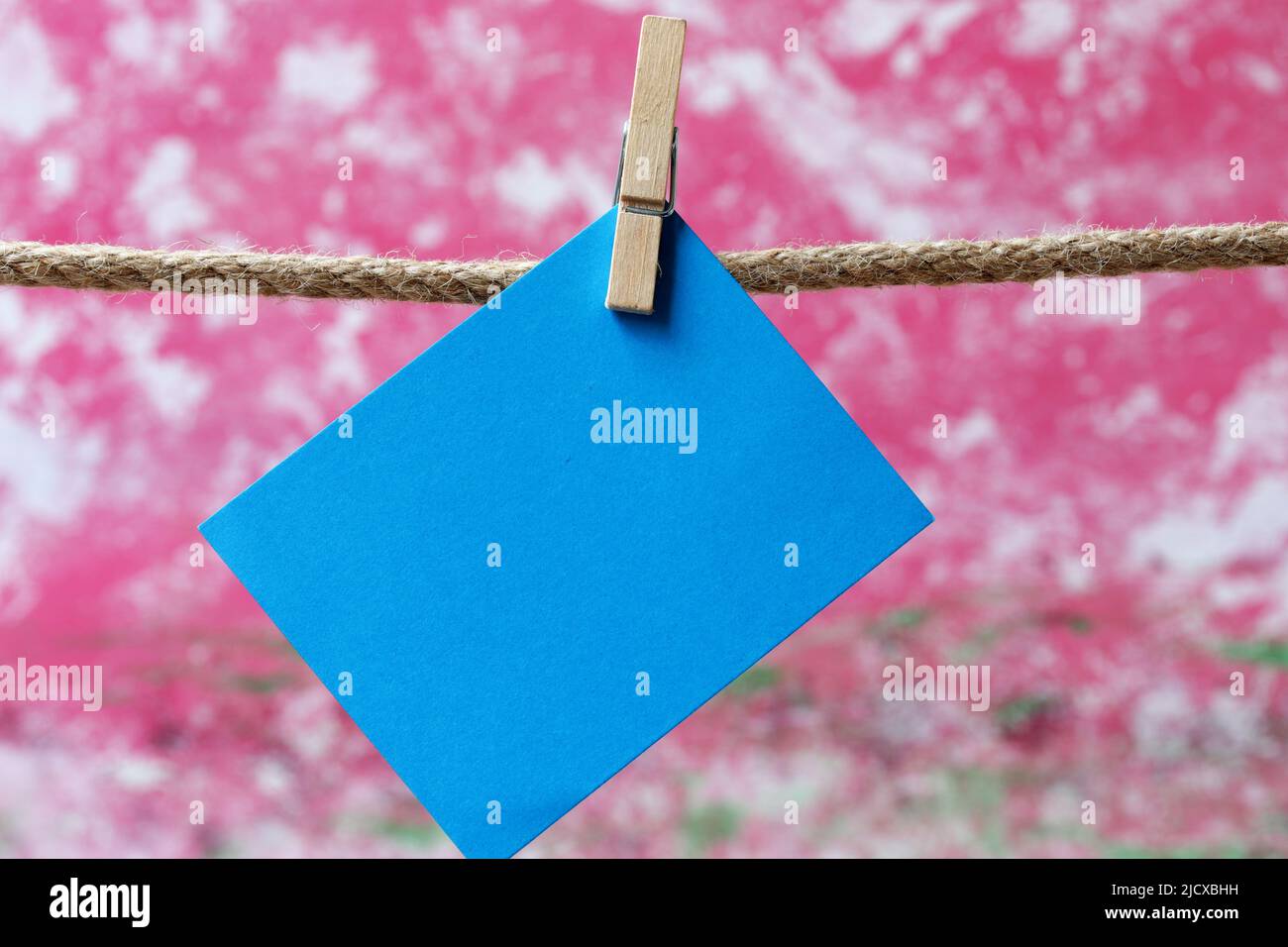 Note paper hanging on clothesline Stock Photo - Alamy