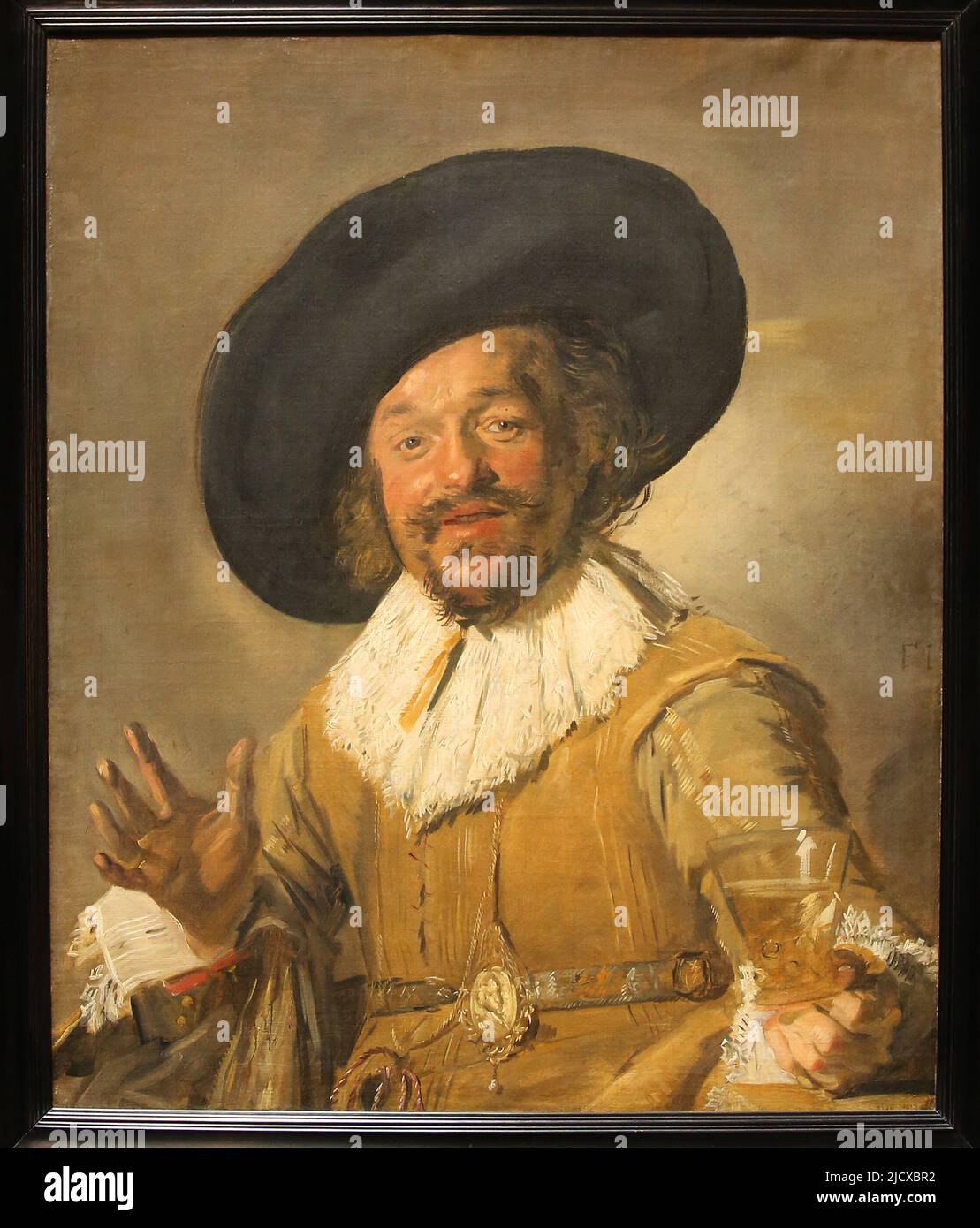A Militiaman Holding a Berkemeyer, known as the 'Merry Drinker' by Frans Hals (c. 1582-1666). Oil on canvas, c. 1628-1630. Rijksmuseum. Amsterdam. Net Stock Photo
