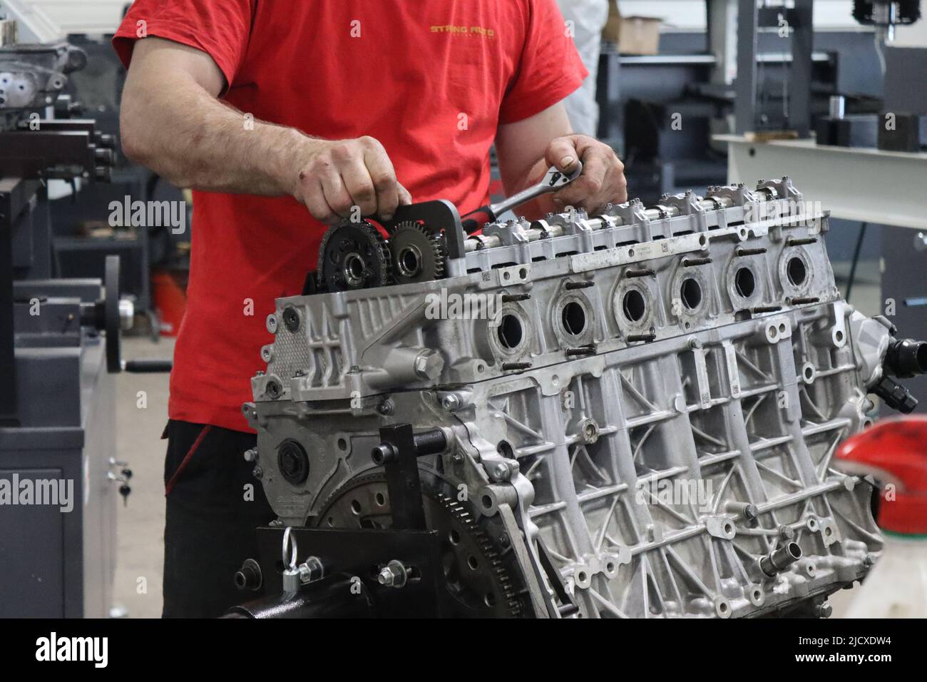 Mechanic working on diesel engine in the engine repair wokrshop Stock Photo