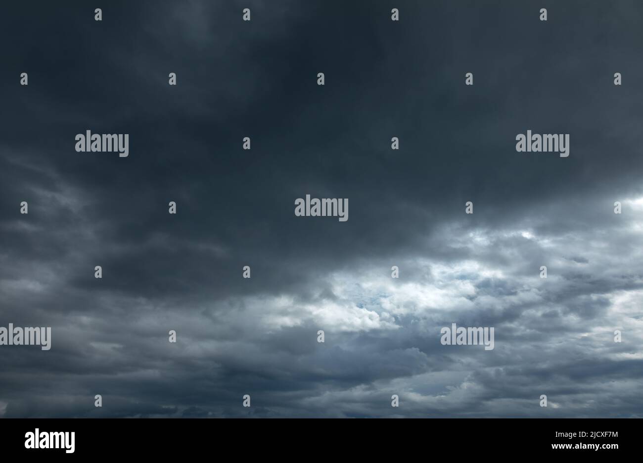 Dramatic sky with dark stormy clouds before thunderstorm natural background Stock Photo