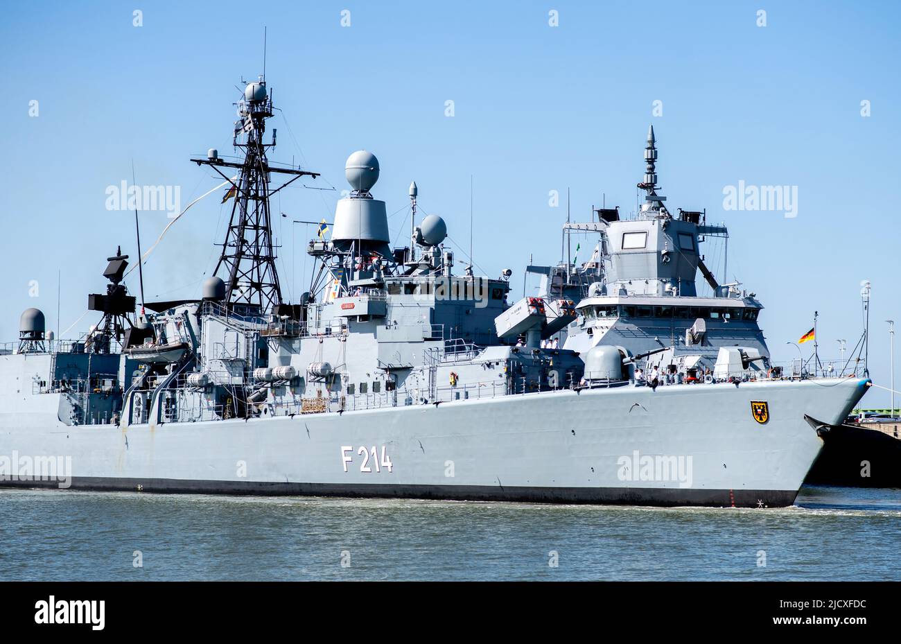 Wilhelmshaven, Germany. 16th June, 2022. The frigate 'Lübeck' enters the harbor at the naval base. After 32 years of service, the ship has returned from a deployment for the last time. The crew of the warship headed for their home port of Wilhelmshaven after a five-month deployment in the Mediterranean. Credit: Hauke-Christian Dittrich/dpa/Alamy Live News Stock Photo