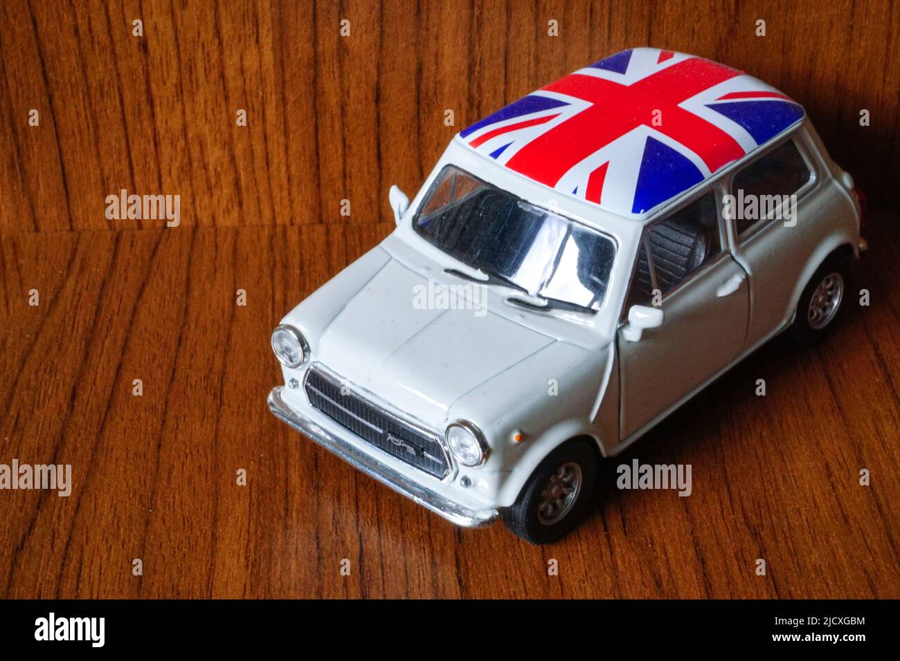 9 May 2021 Eskisehir Turkey White Austin Mini with Britain flag on top 1 24 diecast on wooden background Stock Photo