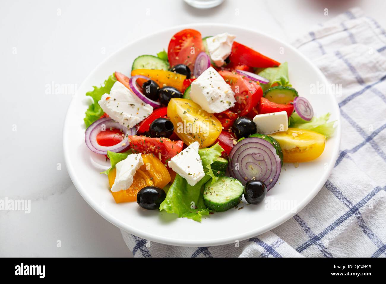 Close up of Greek salad on light surface mediterranean food Stock Photo
