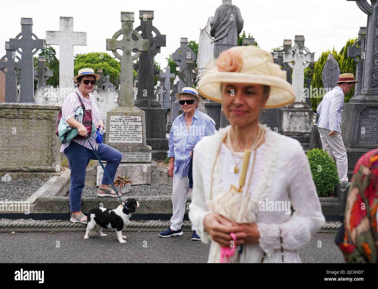 People attend a Joycestagers reenactment from the 'Hades' chapter of Ulysses at Glasnevin Cemetery, Dublin, as part of the annual Bloomsday celebrations. Bloomsday is a celebration of the life of Irish writer James Joyce, observed annually worldwide on June 16, the day his 1922 novel Ulysses takes place in 1904, the date of his first outing with his wife-to-be Nora Barnacle. The day is named after its protagonist Leopold Bloom. Picture date: Wednesday August 25, 2021. Stock Photo