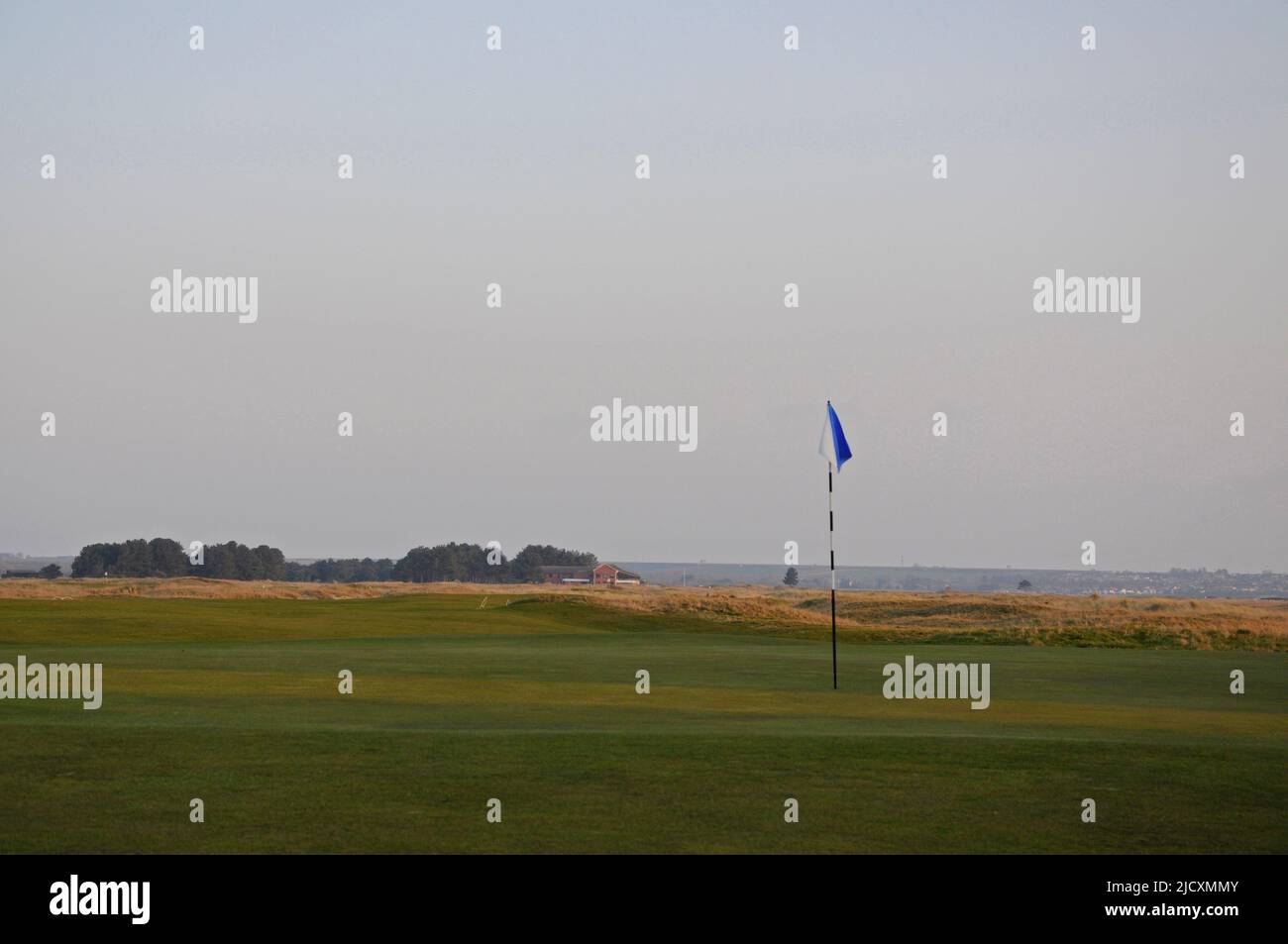 view over 5th Green on The Dunes Course, towards the Clubhouse; Princes Golf Club, Sandwich, Kent, England Stock Photo