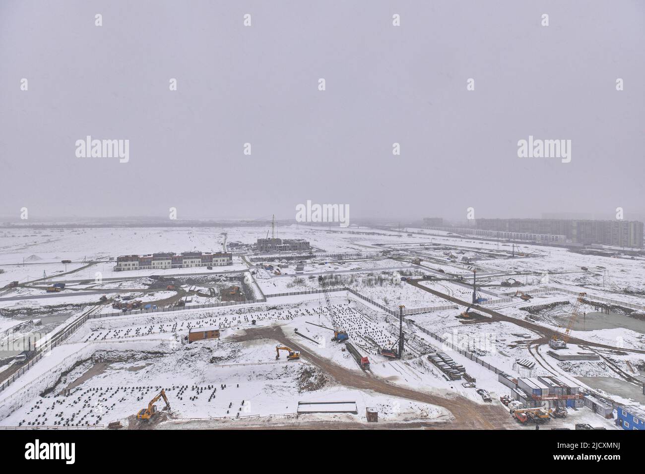View from the window at the construction site in winter  Stock Photo