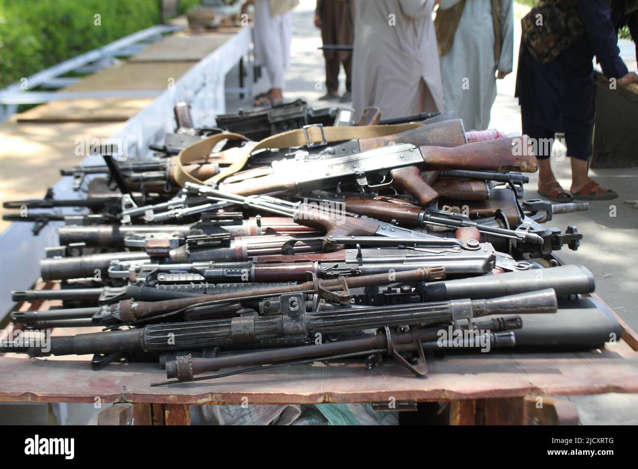 Nangarhar. 14th June, 2022. Photo taken on June 14, 2022 shows assault rifles seized by Afghan security forces in Nangarhar province, Afghanistan. Afghan security forces have seized 48 assault rifles including AK-47 in the eastern Nangarhar province, the state-run Bakhtar news agency reported on Thursday. In the operation, security personnel also discovered a large quantity of other weapons and ammunition including anti-personnel and anti-tank mines, the report said. Credit: Hamidullah/Xinhua/Alamy Live News Stock Photo